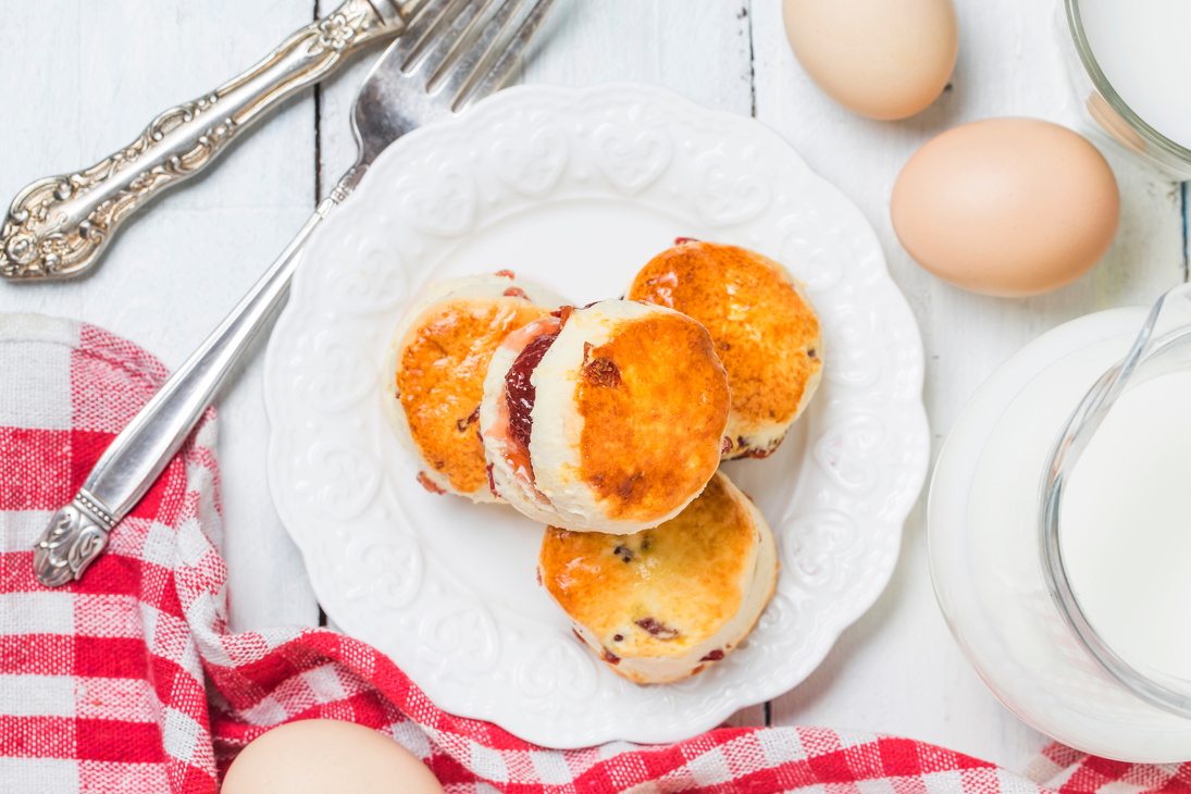 Scones with Jam and Eggs with Milk  on the Table