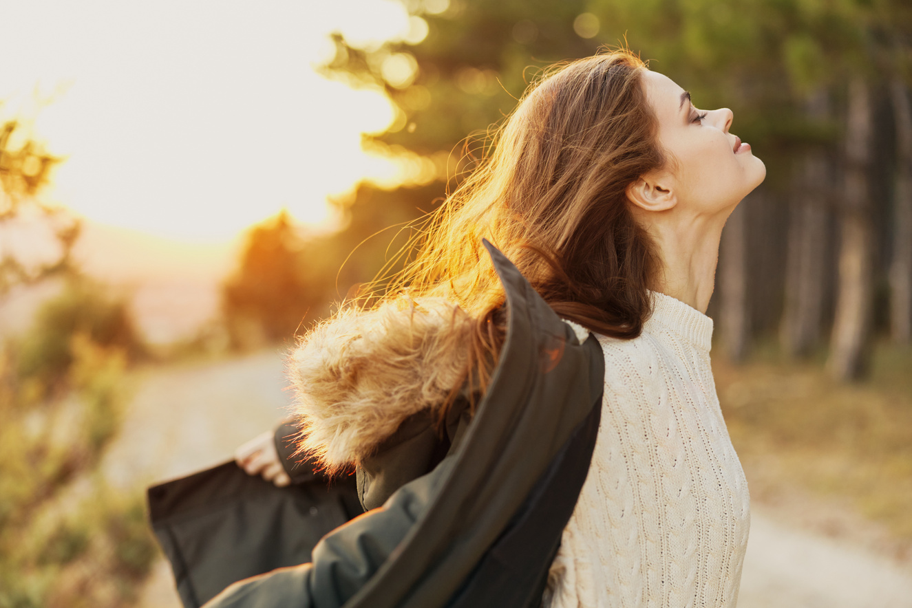 Woman Tourist with Closed Eyes with Head Raised Fresh Air Travel